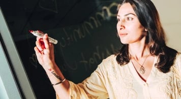 Person holding a marker